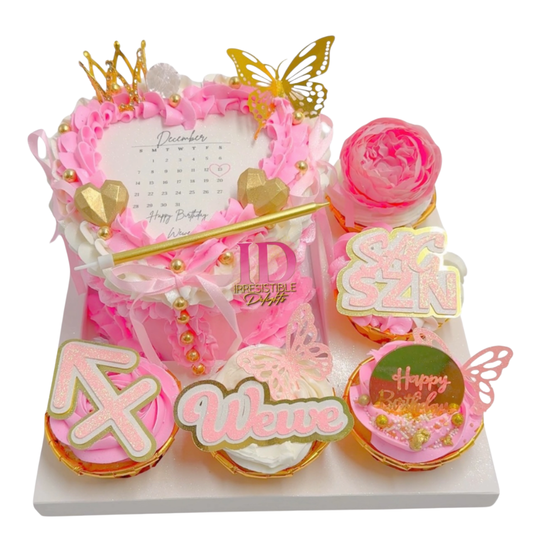 Pink heart cake with cupcakes